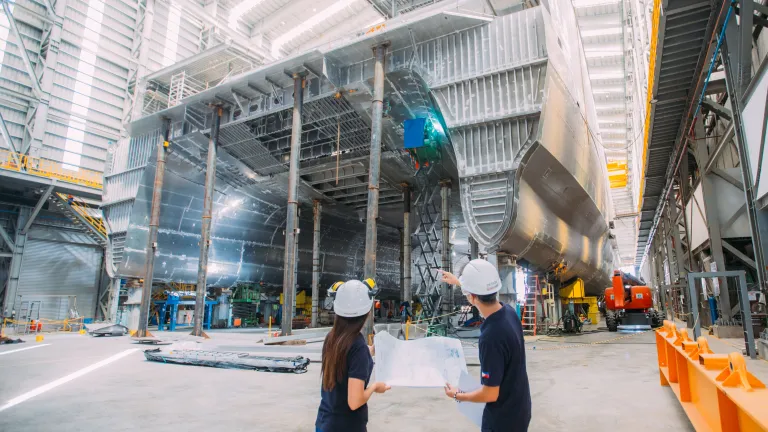 Image of Austal Philippines employees in the shipyard.
